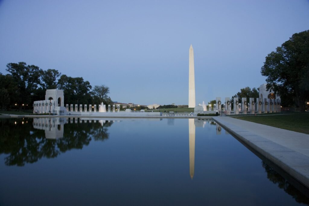 The Washington Monument reflected in the Reflecting Pool at sunset, one of the best free things to do in Washington DC